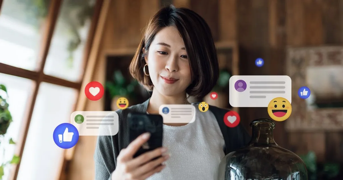 Woman holding smartphone with social media icons and messages floating around her, representing online engagement and community interaction.